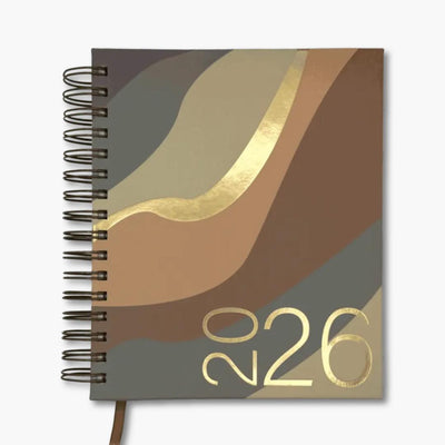 agenda 2026 con anillas y portada con formas geométricas como olas