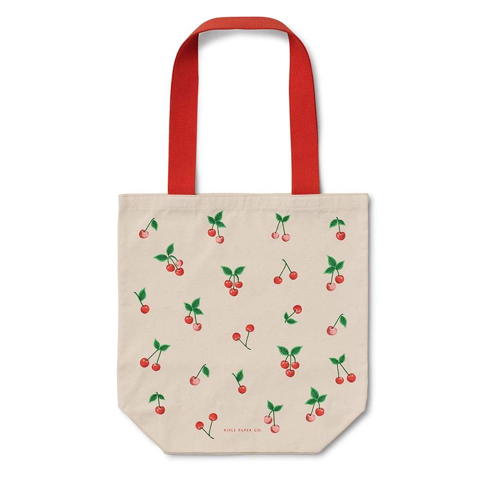Bolsa de tela tote con diseño de cerezas, asas rojas, de Rifle Paper Co. para uso diario.