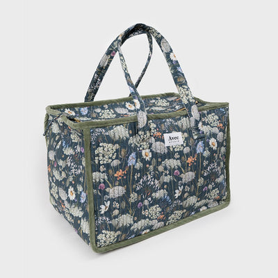 bolso de viaje de tela azul oscuro con flores