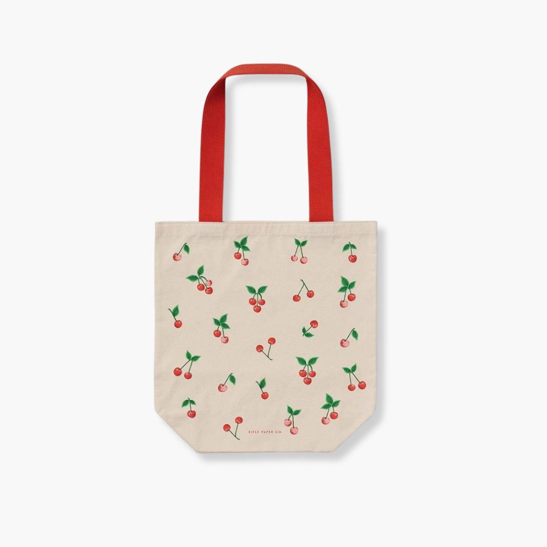Bolsa de tela tote con diseño de cerezas y asas rojas, práctica y resistente.