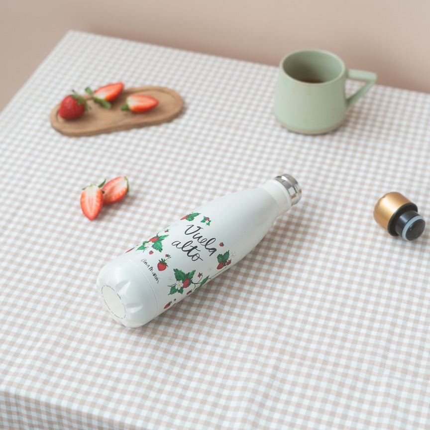 Botella metálica Ana Marin con diseño floral sobre mesa blanca, capacidad 500 ml.