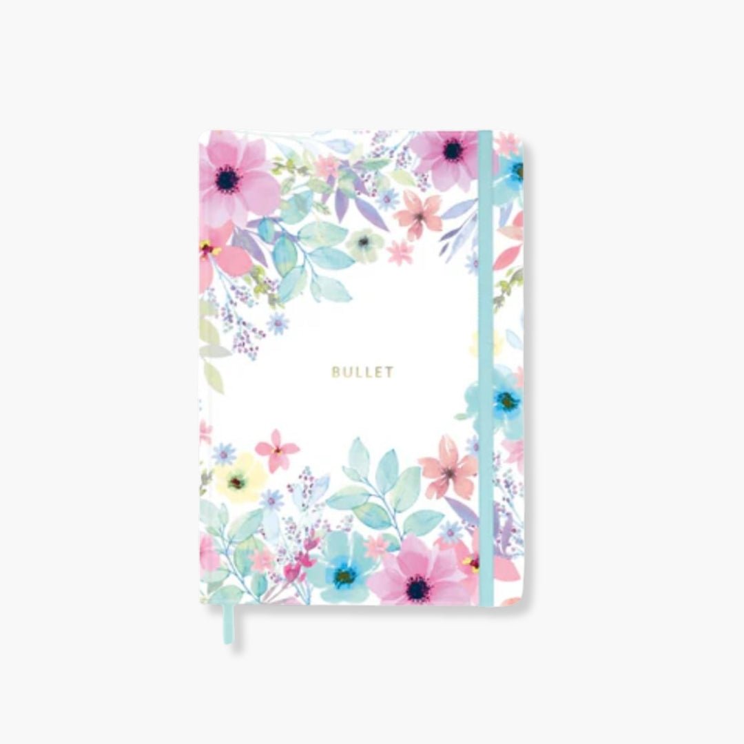 Cuaderno Bullet Journal Viviana, tapa dura floral, cinta azul, 128 páginas punteadas, detalles dorados.