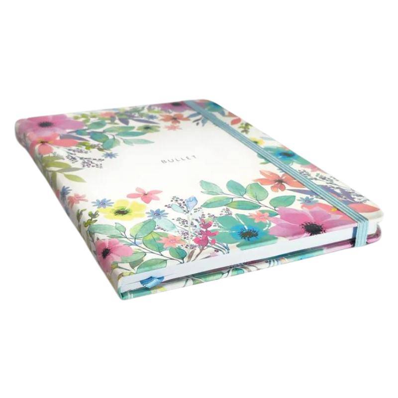 Cuaderno Bullet Journal Viviana con tapa dura floral y goma de cierre.