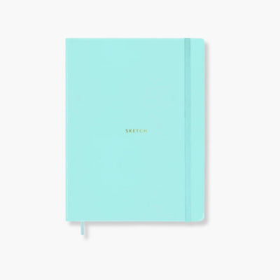 Cuaderno Sketch Lizzie con tapa de polipiel turquesa y detalles dorados.