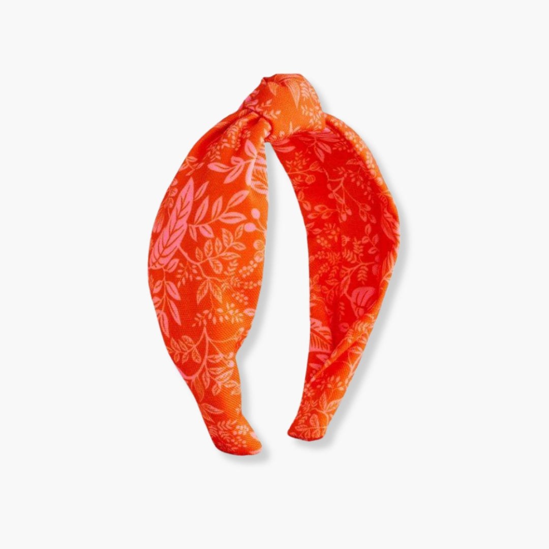 Diadema de tela estampada Canopy con nudo central y diseño Rifle Paper Co. en poliéster naranja.