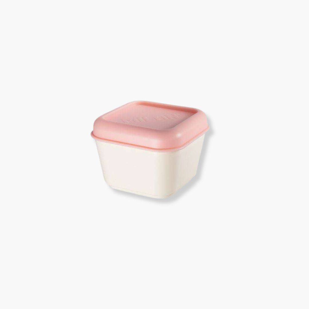 Fiambrera cuadrada rosa de 0.33L con acabado mate y esquinas redondeadas para comida ligera.
