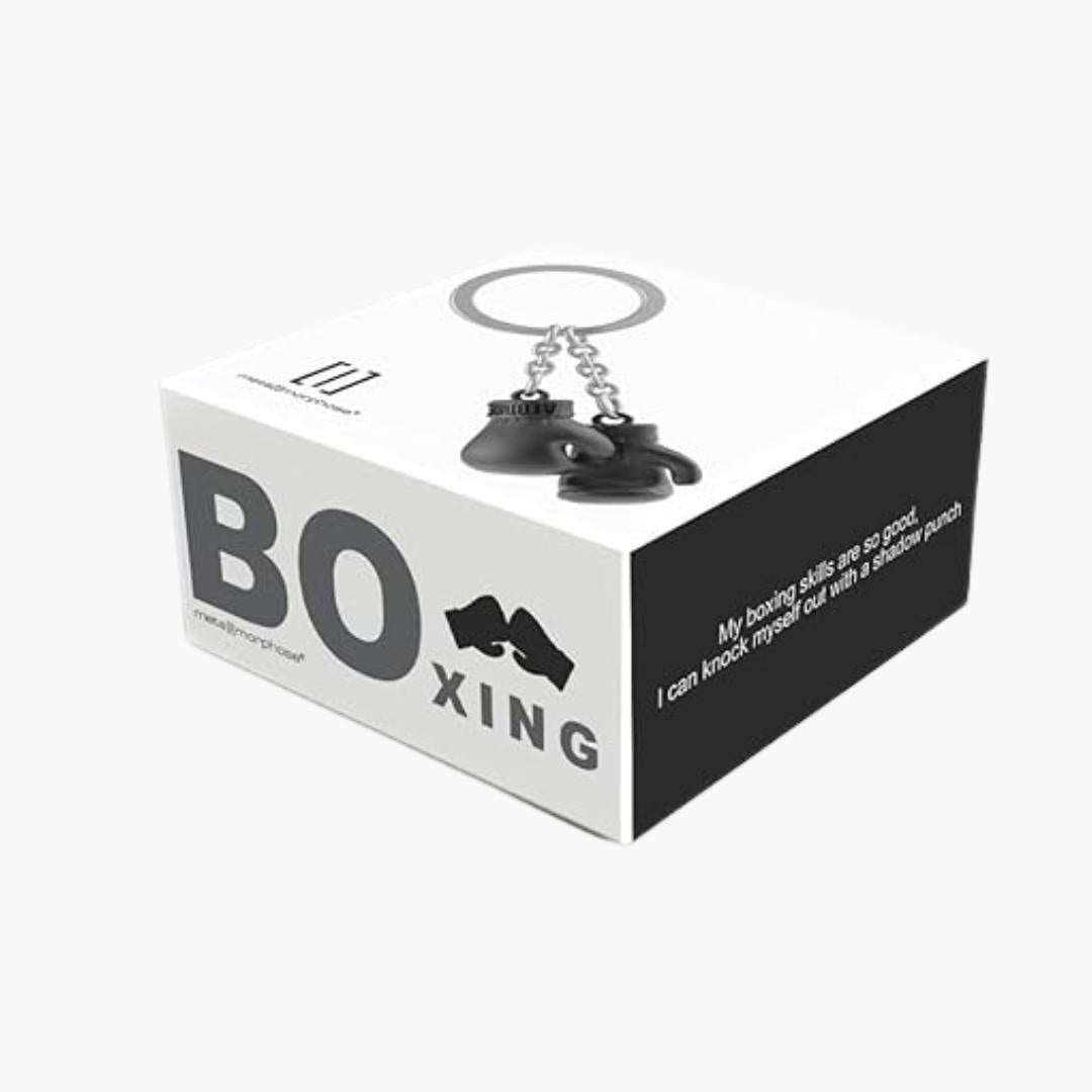 Llavero 3D de metal en caja de presentación temática, diseño de guantes de boxeo.