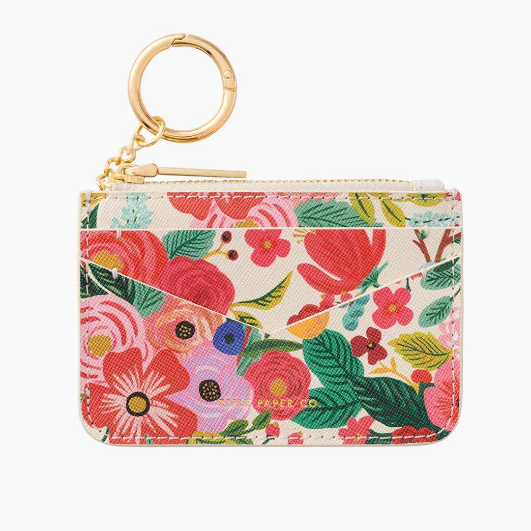 Llavero Monedero Garden Party con estampado floral, multifuncional y compacto.