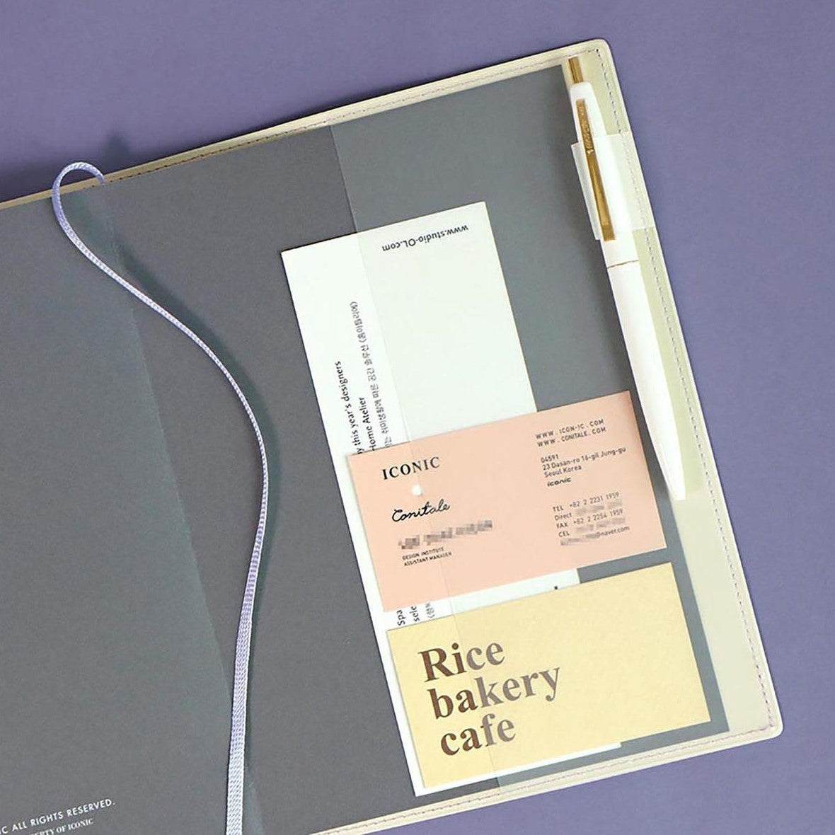 Office Planner ICONIC Ivory with flexible PVC cover and organizational stickers.