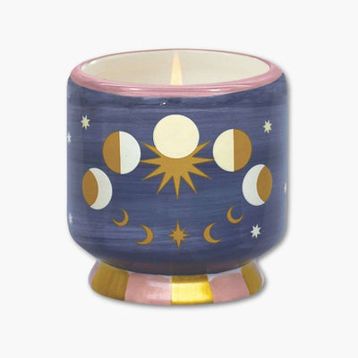 vela perfumada paddywax en recipiente de cerámica pintada con fases lunares
