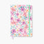 Cuaderno Bullet Journal Mari con tapa dura floral y cierre elástico colorido.