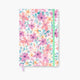 Cuaderno Bullet Journal Mari con tapa dura floral y cierre elástico colorido.