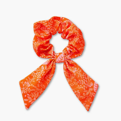 coletero de tela naranja con flores