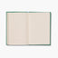 hojas rayadas del cuaderno con portada de tela rosa estilo vintage