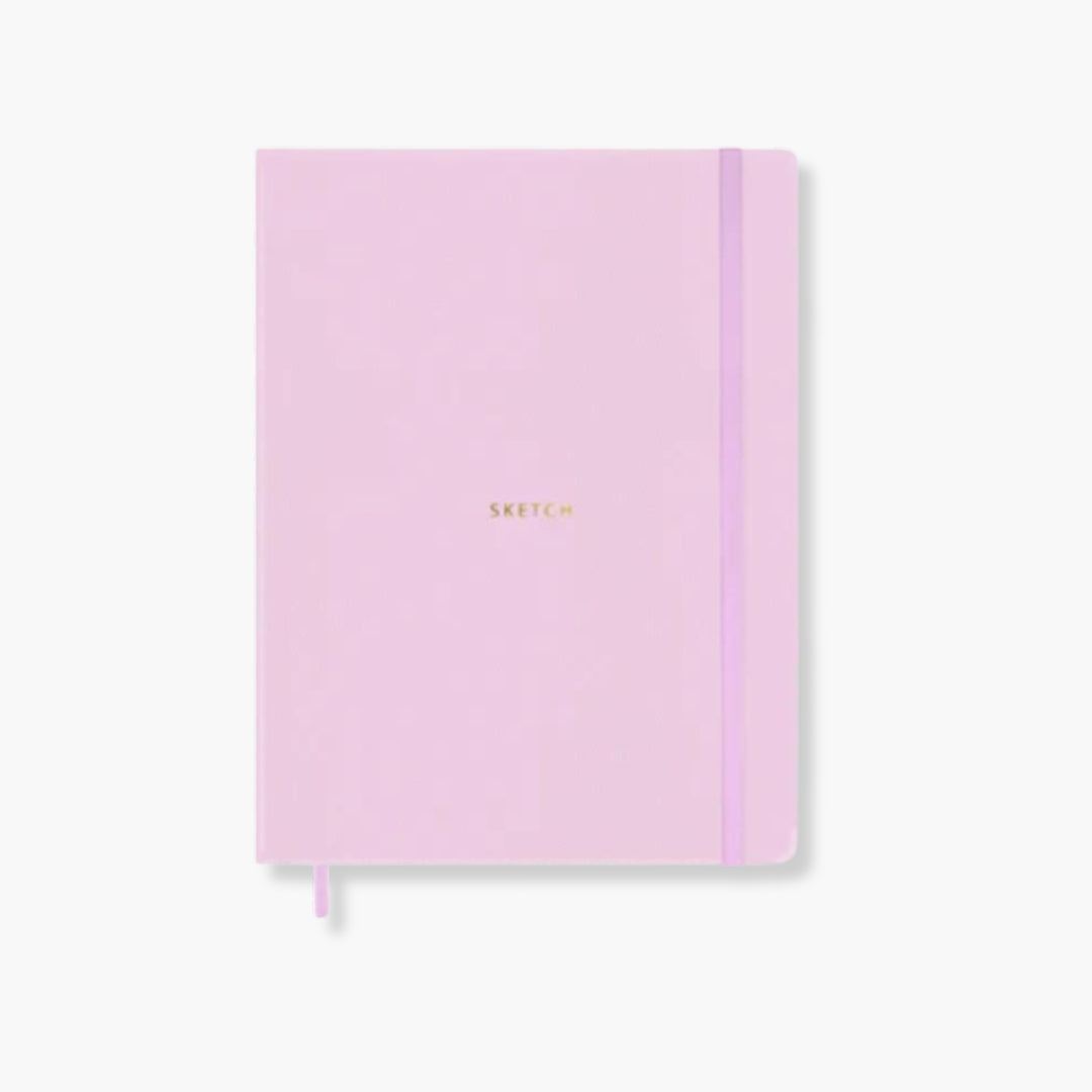 Cuaderno SKETCH Nancy con tapa de polipiel rosa y cierre elástico.
