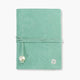 Libreta de piel de vacuno Bari color verde agua, con cierre de cordón, diseño artesanal en España.