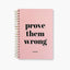 Libreta Prove Them Wrong tapa dura rosa espiral dorado estilo motivacional.