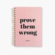 Libreta Prove Them Wrong tapa dura rosa espiral dorado estilo motivacional.